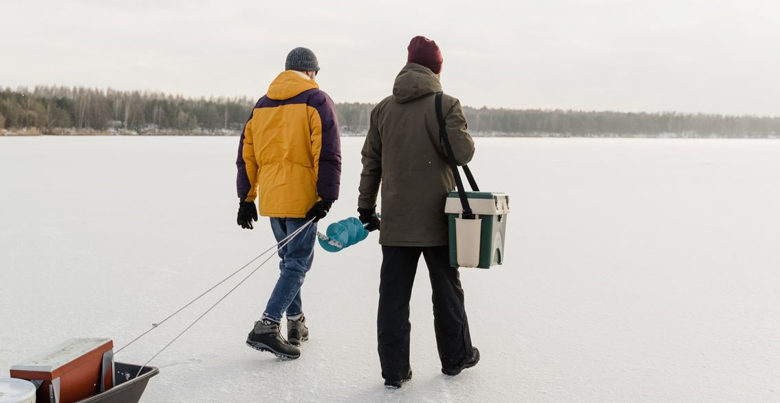 two men walking with heated jacket